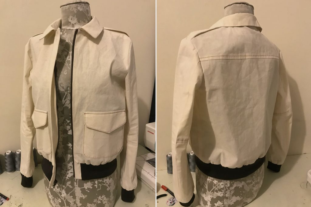 Front and back view of bomber jacket muslin mock-up on tabletop dress form