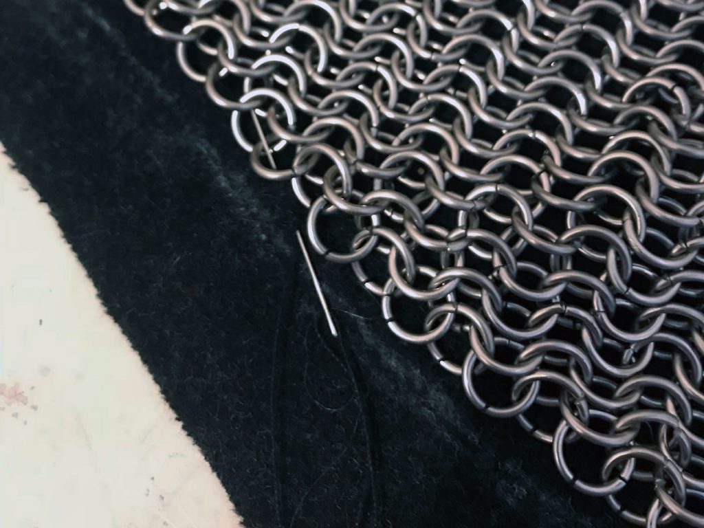 stitching chainmail to wool backing