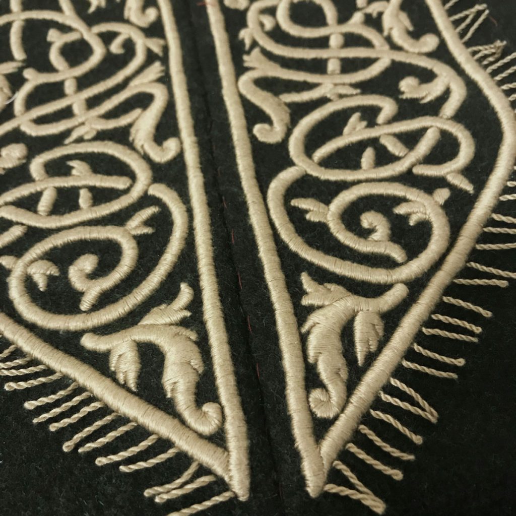 Twisted fringe border added to embroidered panels