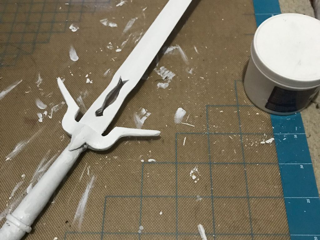 prop sword primed with gesso