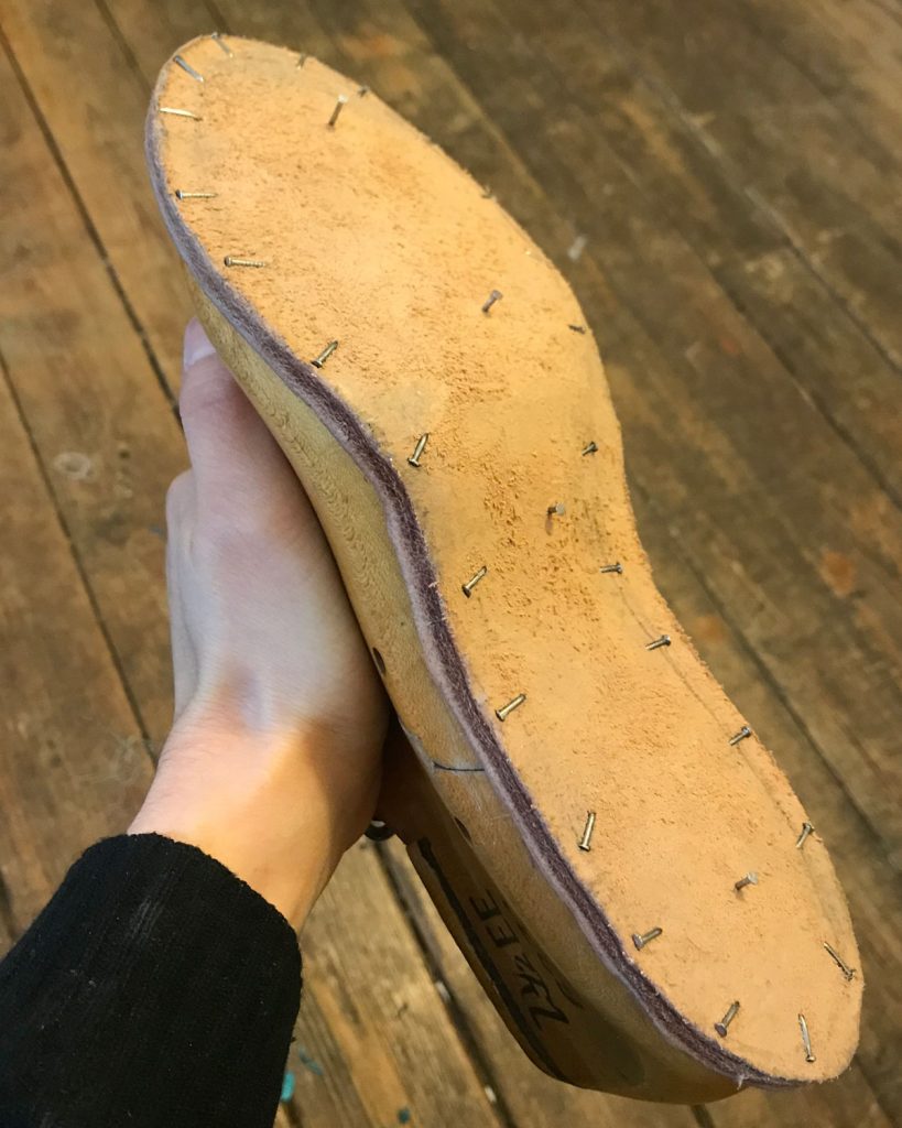 insole soaked and blocked on underside of last