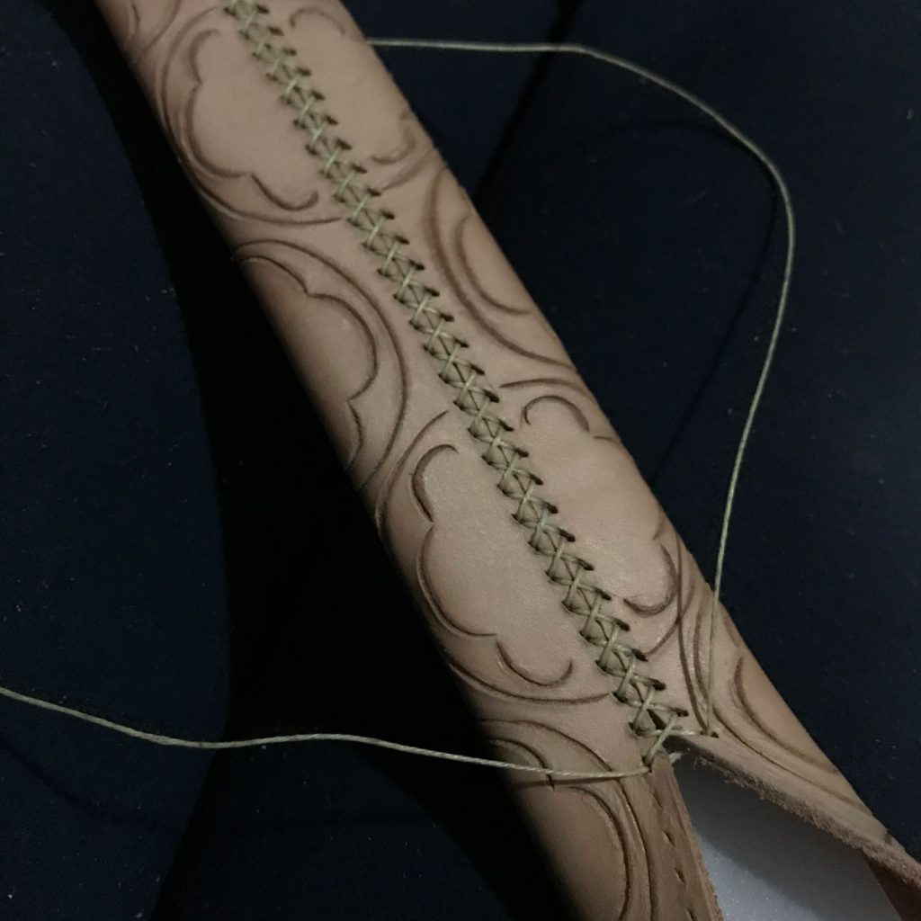 stitching the back seam of the scabbard