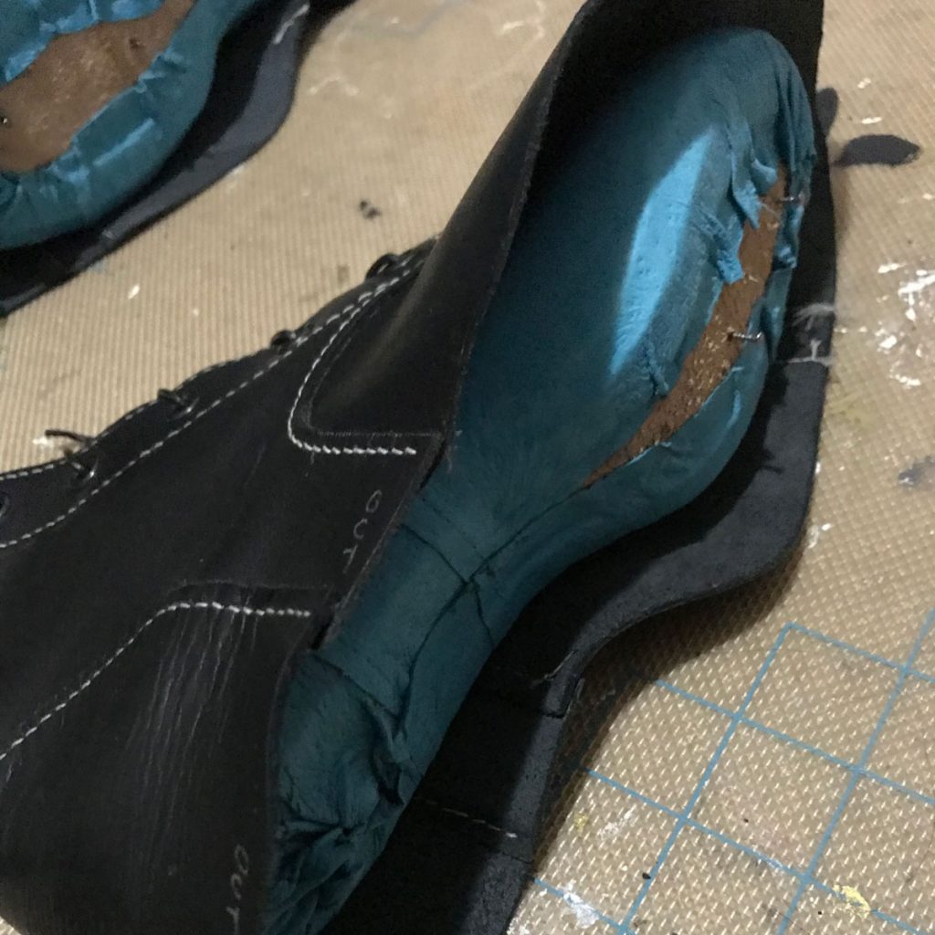 lining stretched over last and insole