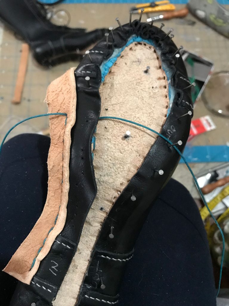 sewing welt to insole through upper