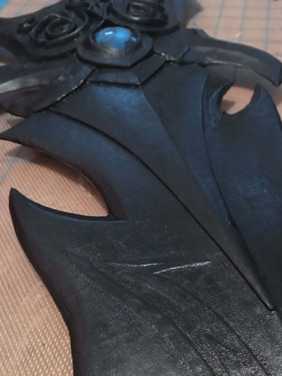 black acrylic base coat on sword prop